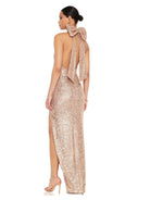 Halter style sequin dress, backless, featuring a large bow for party glamour